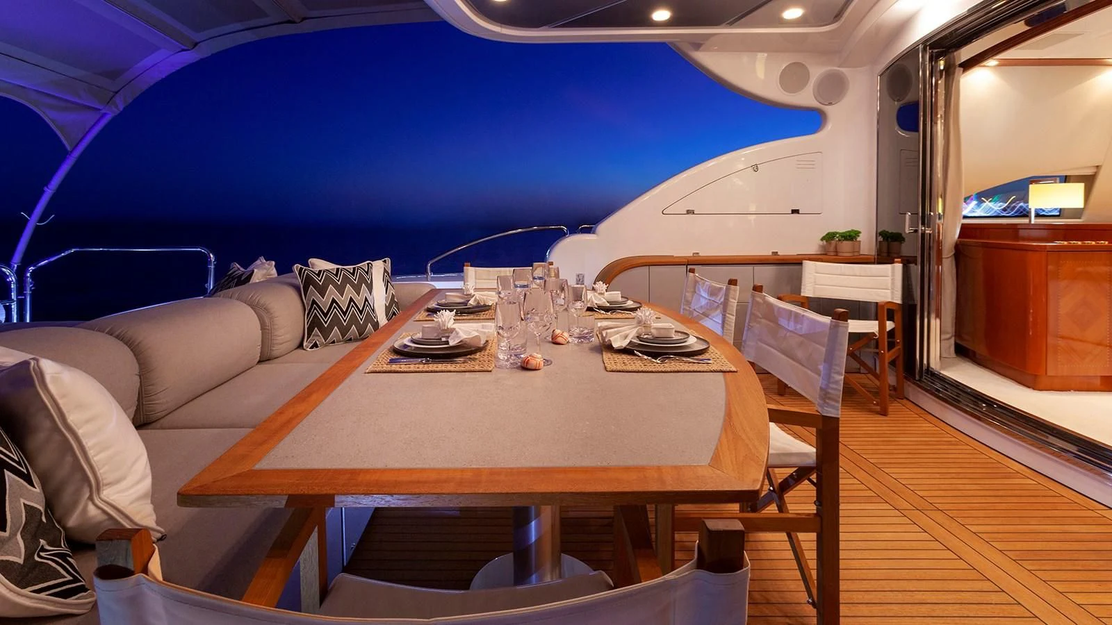 a room with a table and chairs aboard KIDI ONE Yacht for Sale