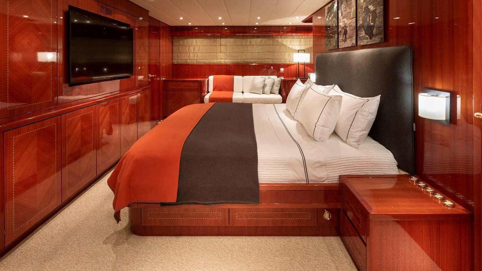 a bed with a black bed aboard KIDI ONE Yacht for Sale