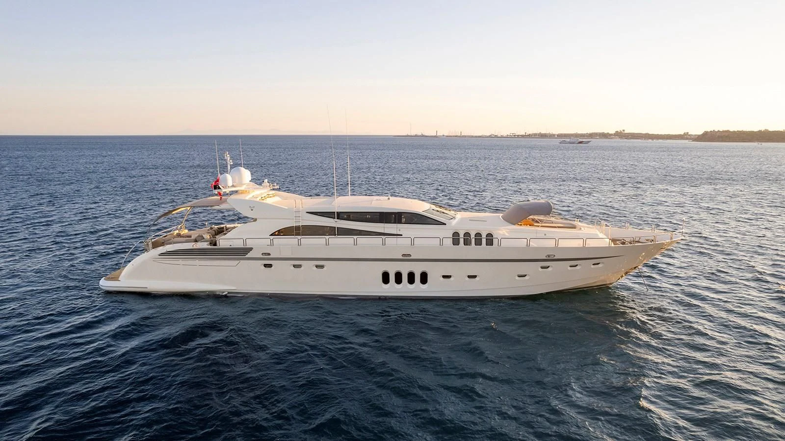 a white yacht in the water aboard KIDI ONE Yacht for Sale