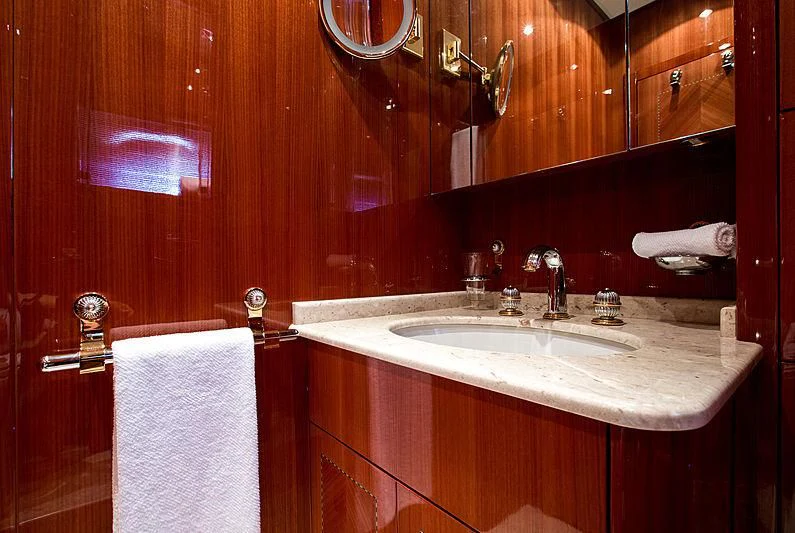 a bathroom with a sink and a mirror aboard KIDI ONE Yacht for Sale