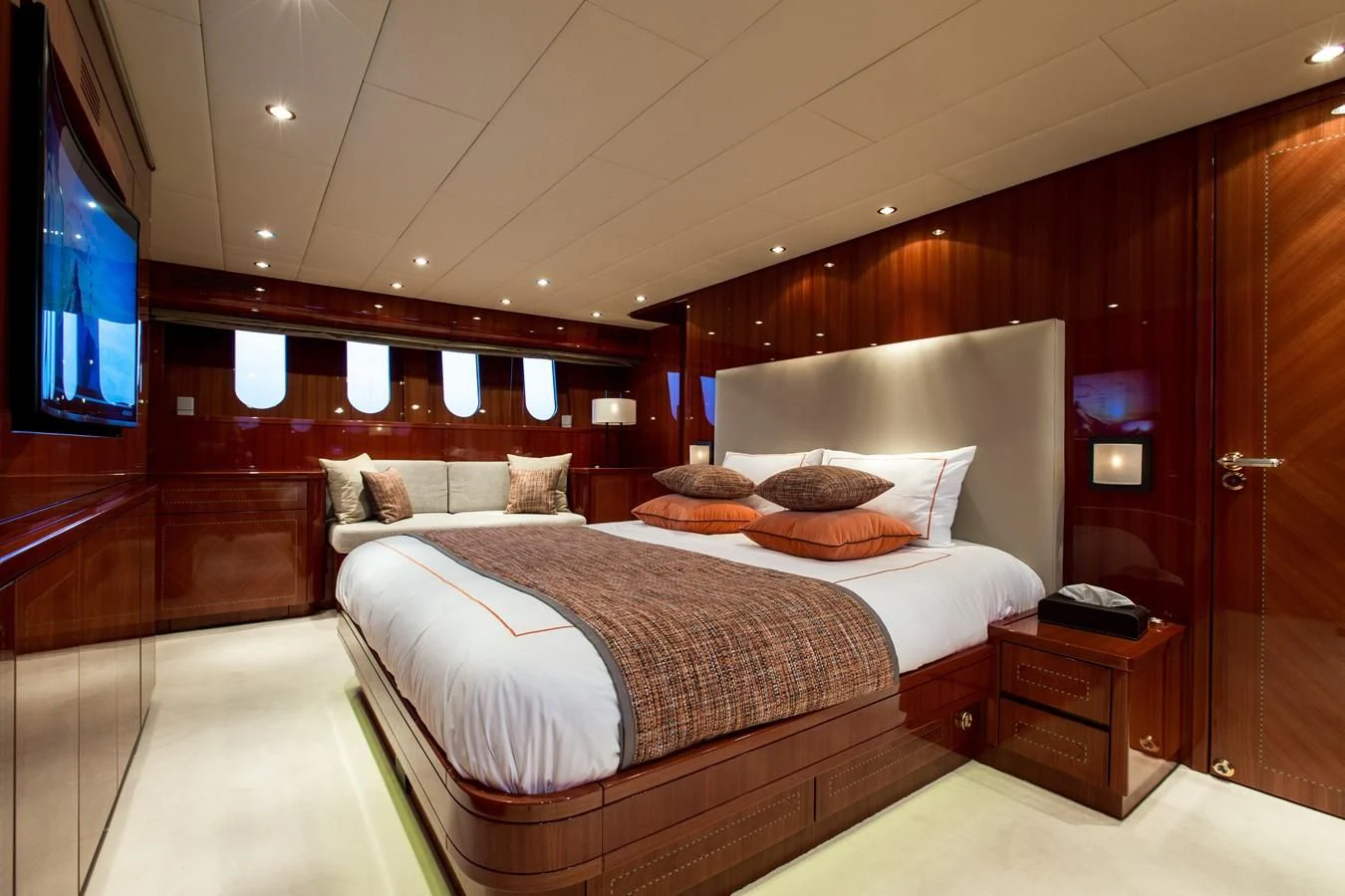 a room with a bed and a television aboard KIDI ONE Yacht for Sale
