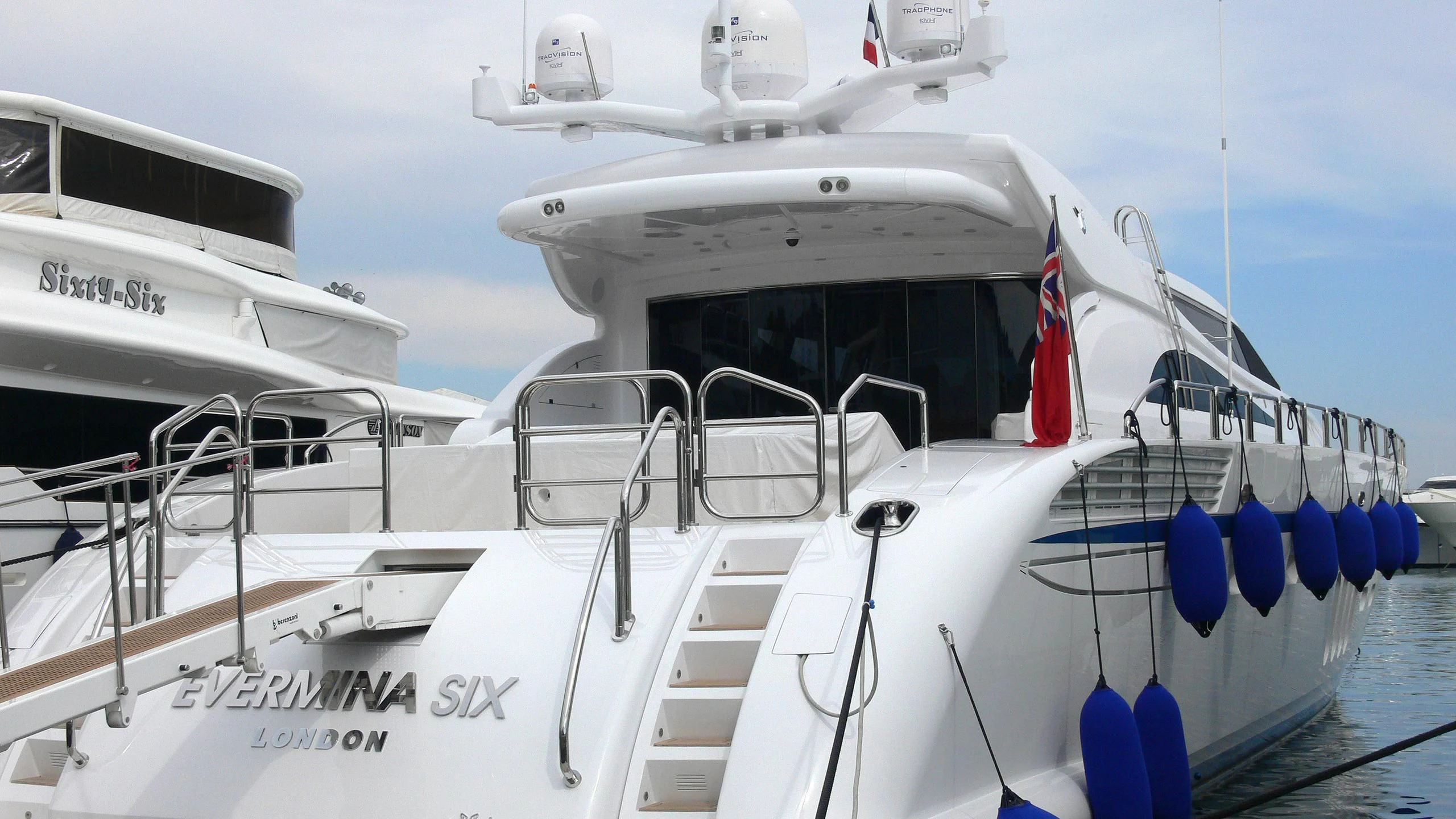 a boat with a flag on the front aboard KIDI ONE Yacht for Sale