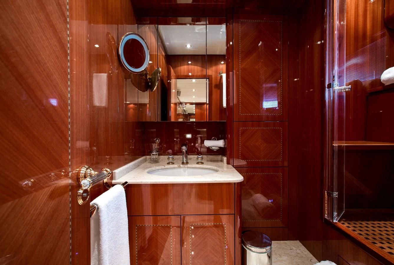 a bathroom with a sink and mirror aboard KIDI ONE Yacht for Sale