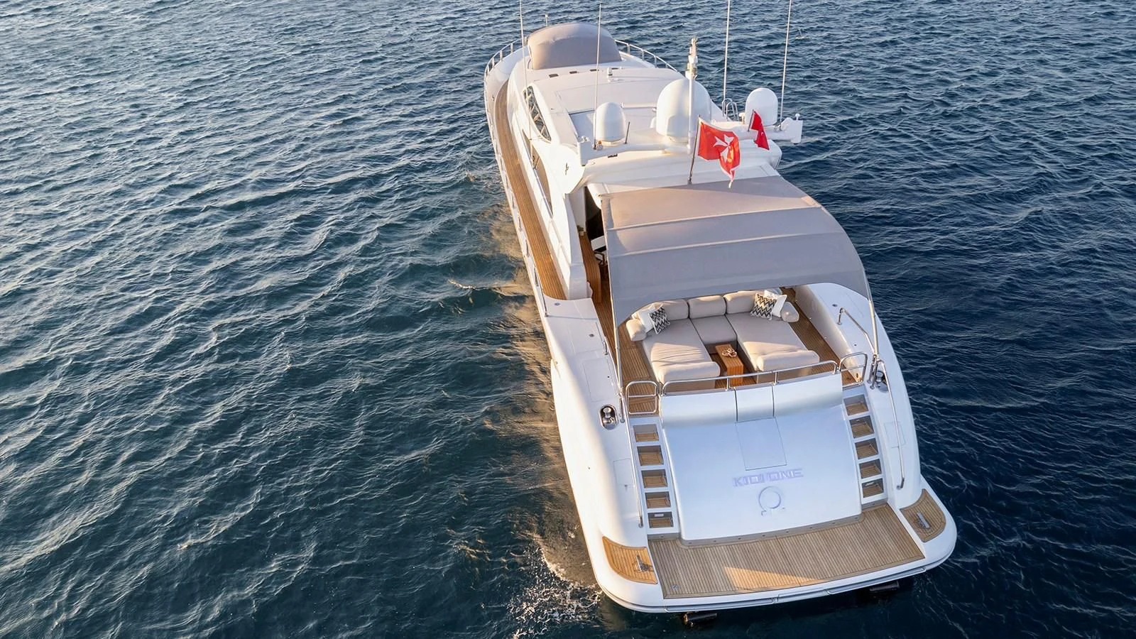 a white boat on the water aboard KIDI ONE Yacht for Sale