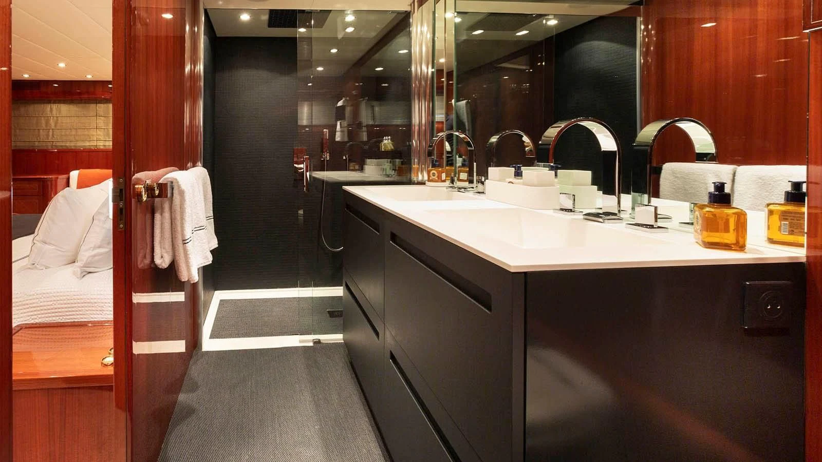 a bathroom with a sink and a mirror aboard KIDI ONE Yacht for Sale