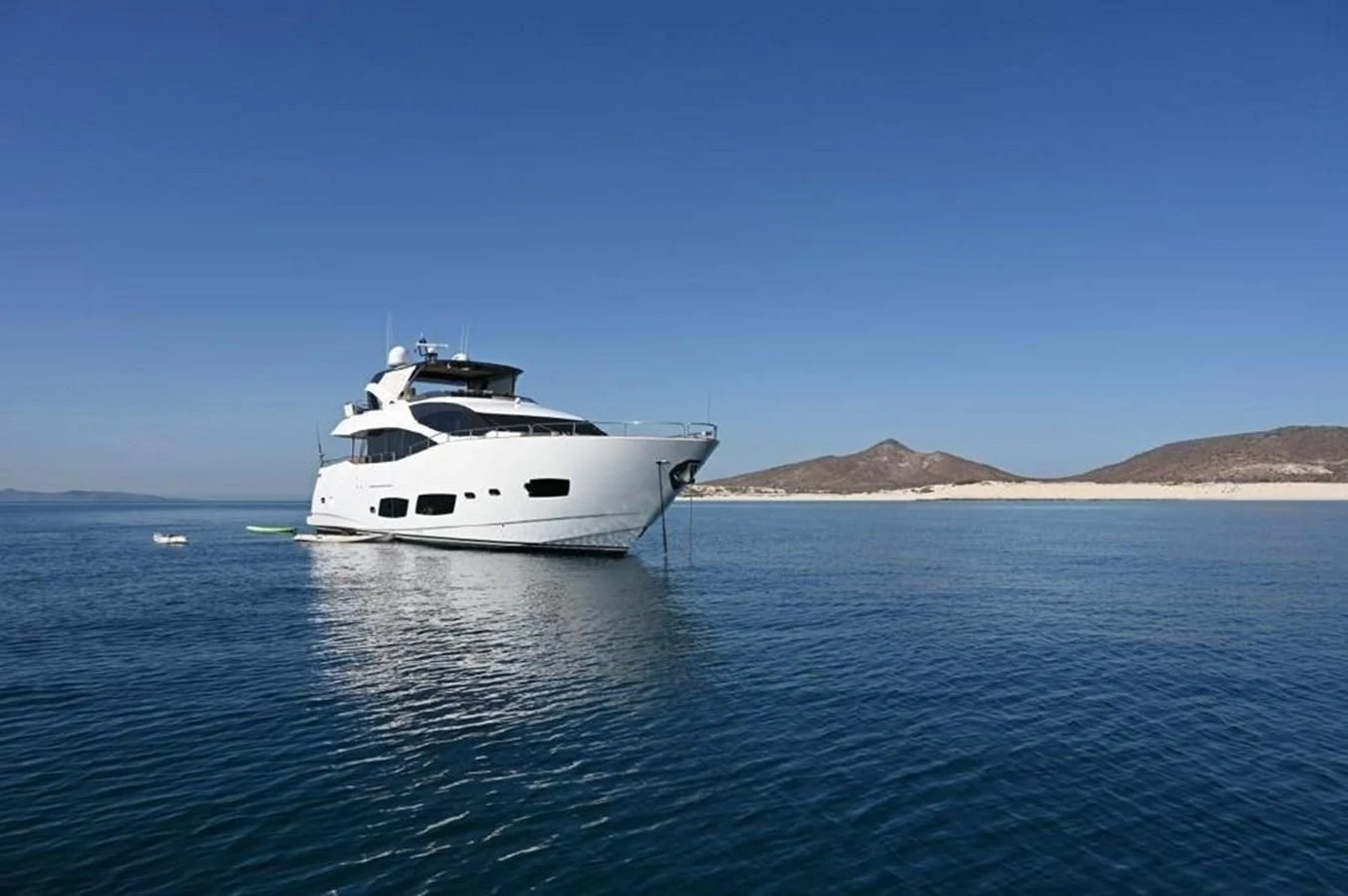 a white boat in the water aboard BRAVA Yacht for Sale