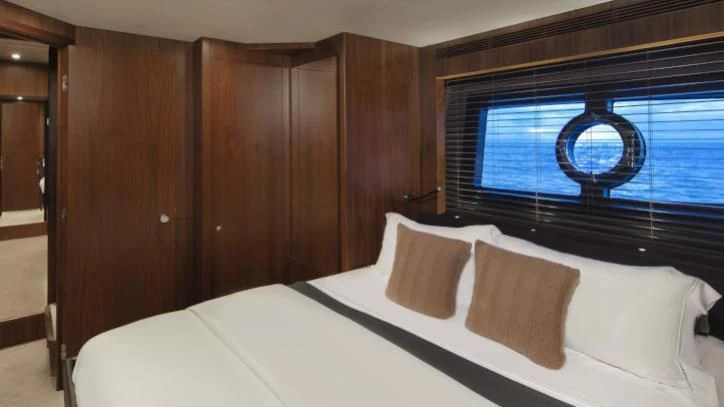 a bed with pillows aboard BRAVA Yacht for Sale