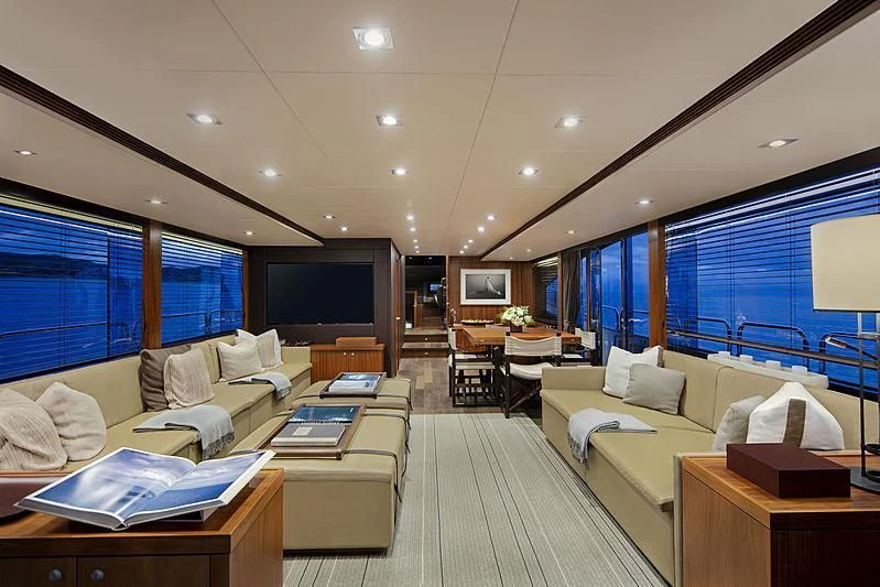 a living room with a large window aboard BRAVA Yacht for Sale