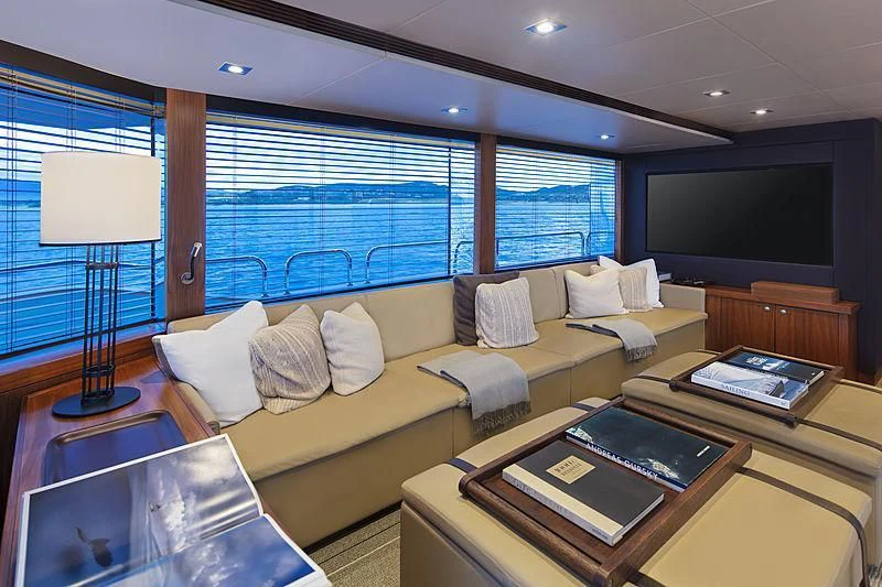 a living room with a large window aboard BRAVA Yacht for Sale