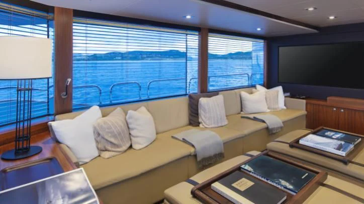 a living room with a large window aboard BRAVA Yacht for Sale