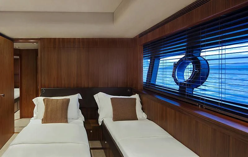 a room with two beds aboard BRAVA Yacht for Sale
