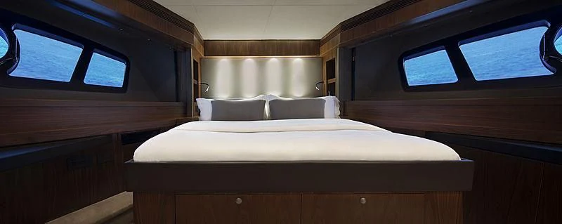a bed in a room aboard BRAVA Yacht for Sale