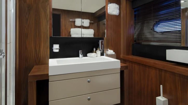 a bathroom with a sink and a mirror aboard BRAVA Yacht for Sale