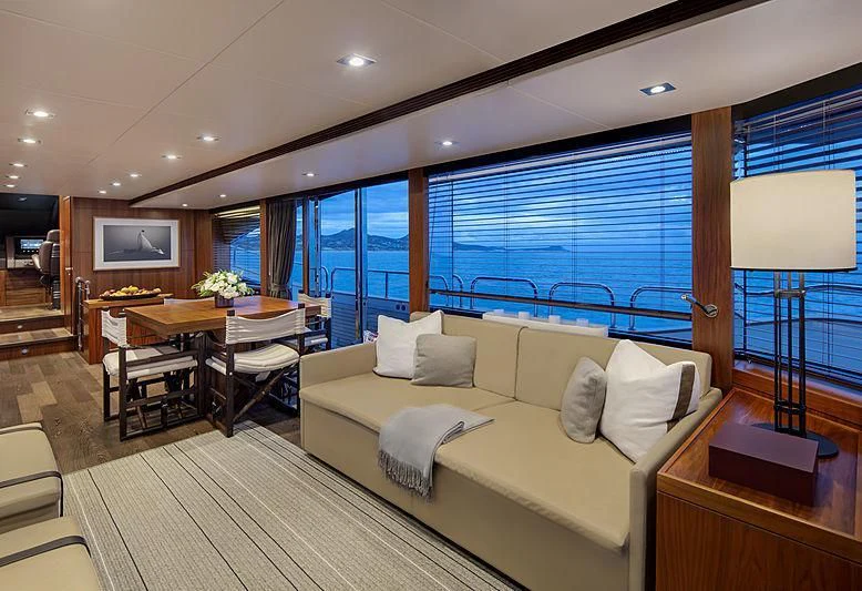 a living room with a large window aboard BRAVA Yacht for Sale