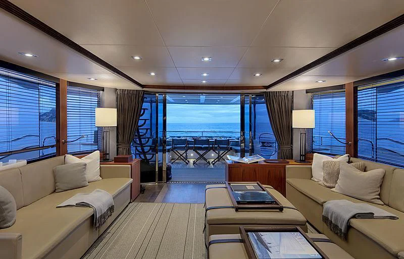 a living room with a large window aboard BRAVA Yacht for Sale