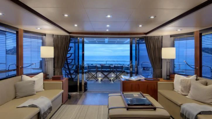 a living room with a large window aboard BRAVA Yacht for Sale