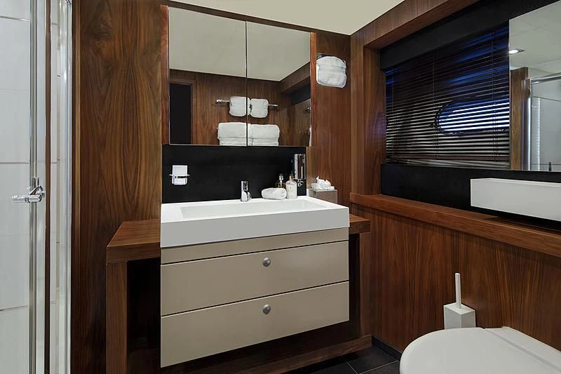 a bathroom with a large mirror aboard BRAVA Yacht for Sale