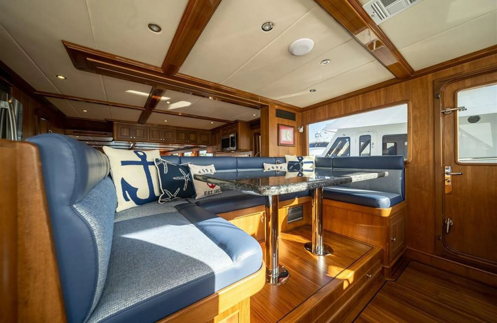 a room with a couch and a pool table aboard JULIANNE Yacht for Sale