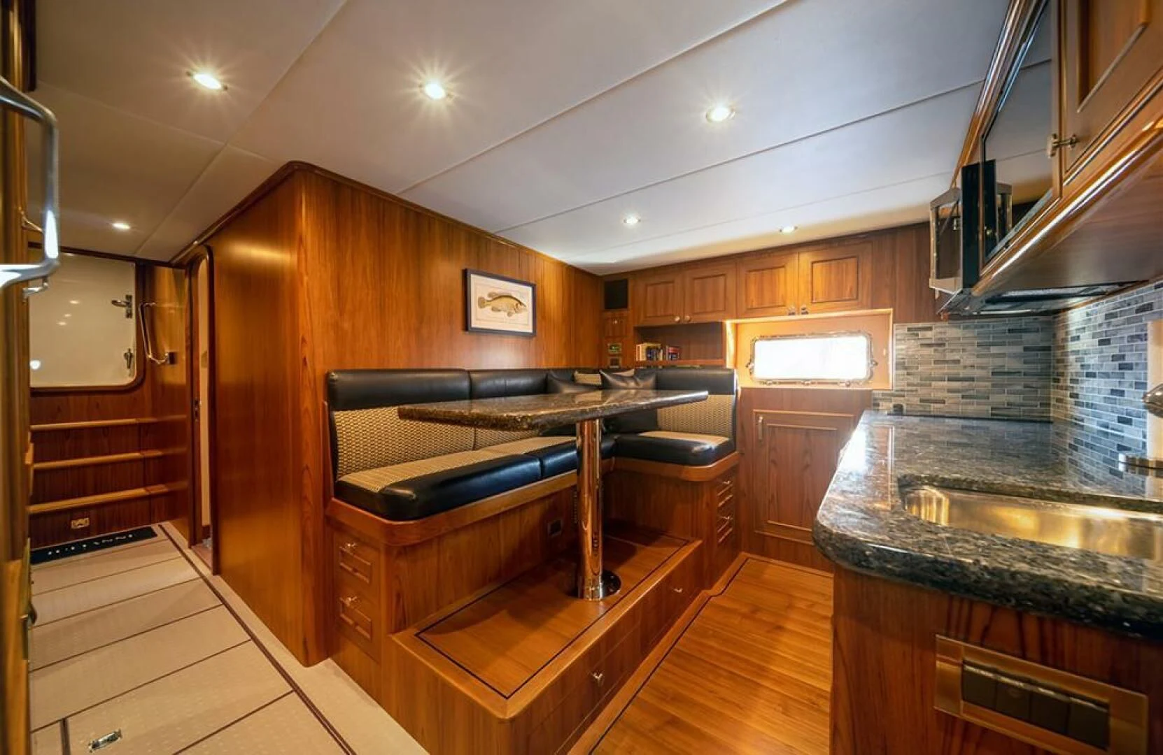 a kitchen with a fireplace aboard JULIANNE Yacht for Sale
