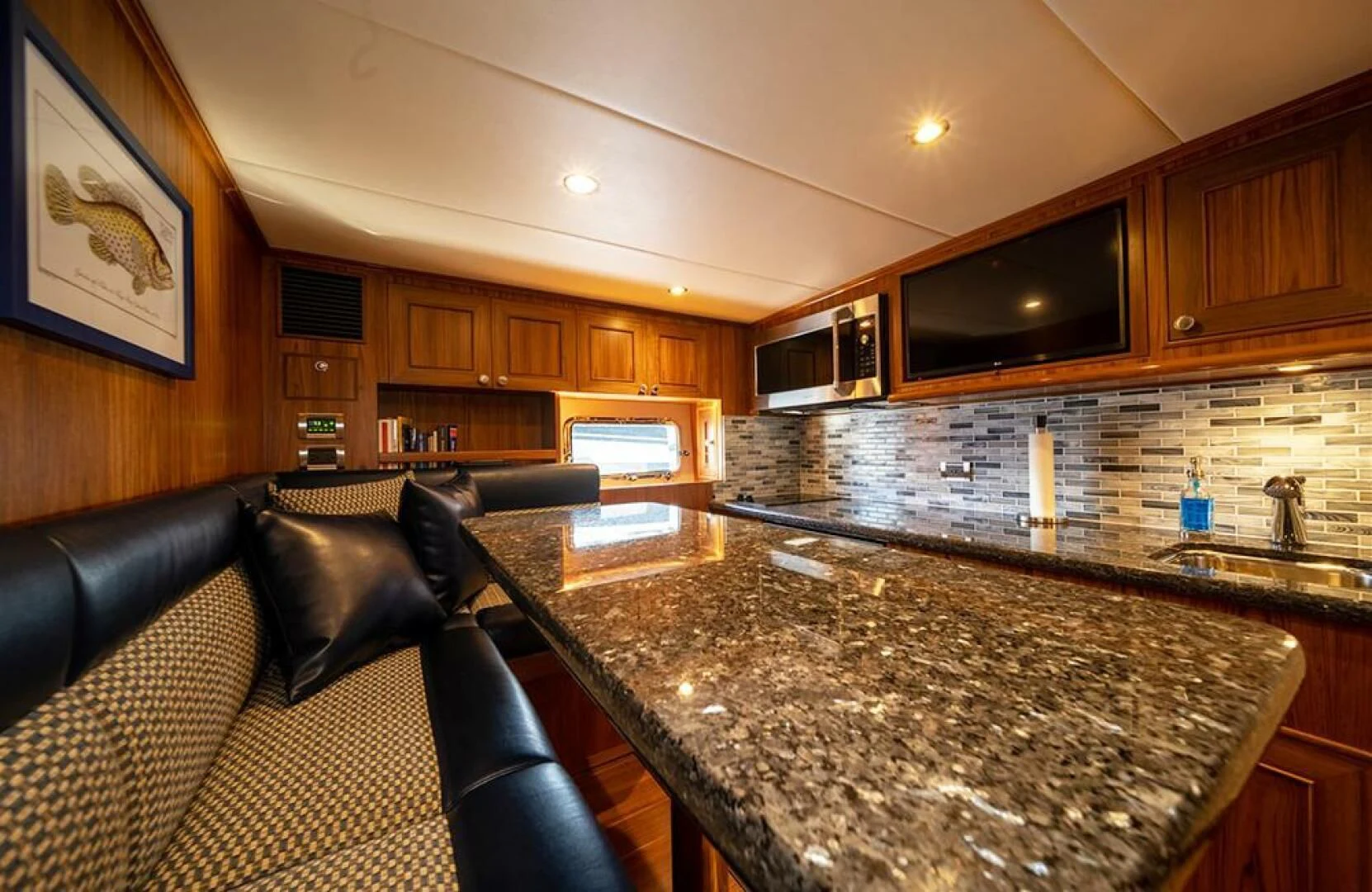 a kitchen with a large marble counter top aboard JULIANNE Yacht for Sale