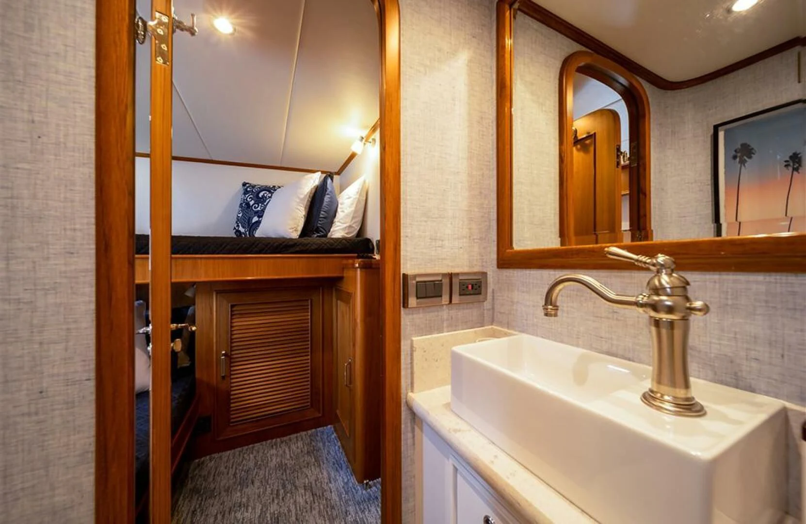 a bathroom with a sink and a mirror aboard JULIANNE Yacht for Sale