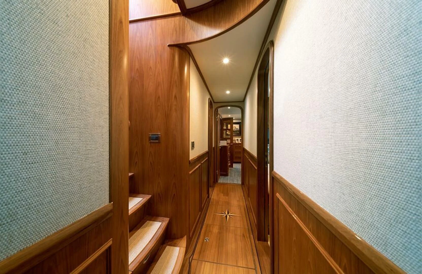 a hallway with wood floors aboard JULIANNE Yacht for Sale