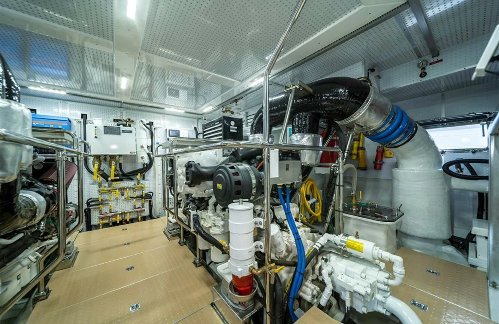 a large white machine with blue cables aboard JULIANNE Yacht for Sale