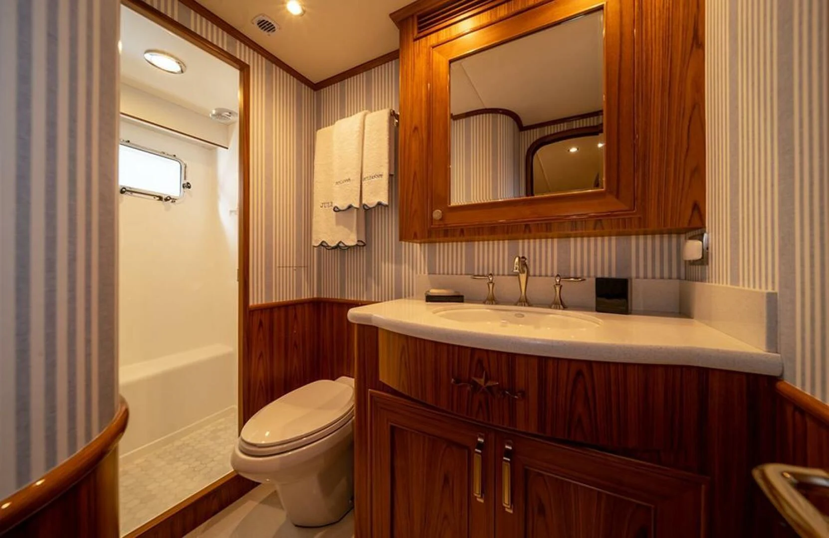 a bathroom with a sink and a toilet aboard JULIANNE Yacht for Sale