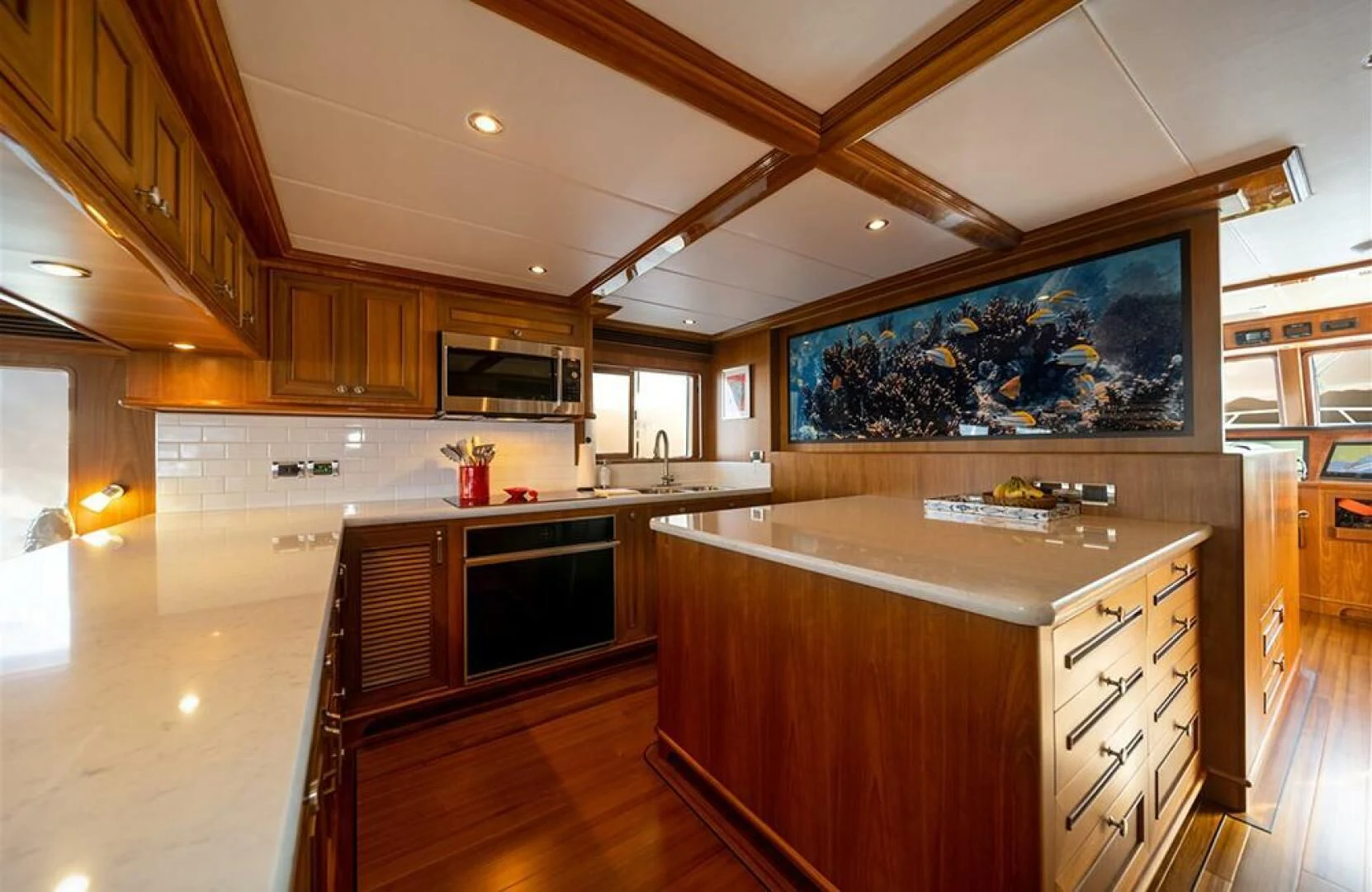 a large kitchen with wooden cabinets aboard JULIANNE Yacht for Sale