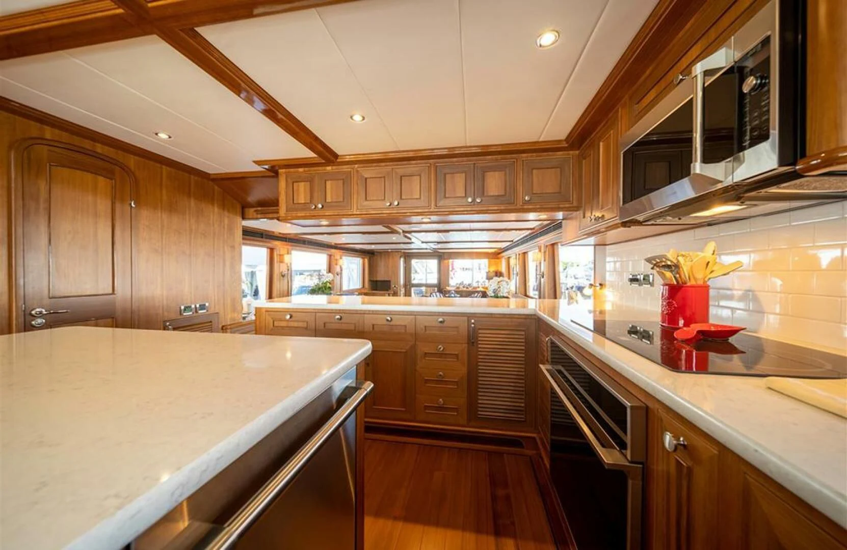 a kitchen with wooden cabinets aboard JULIANNE Yacht for Sale