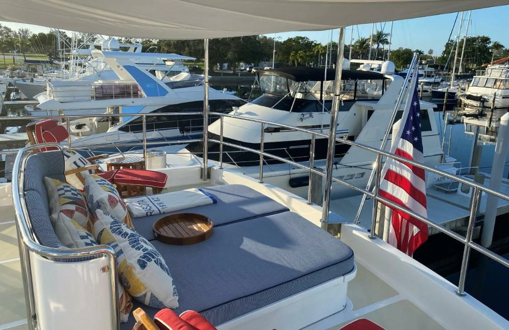 a boat with a flag on the front aboard JULIANNE Yacht for Sale