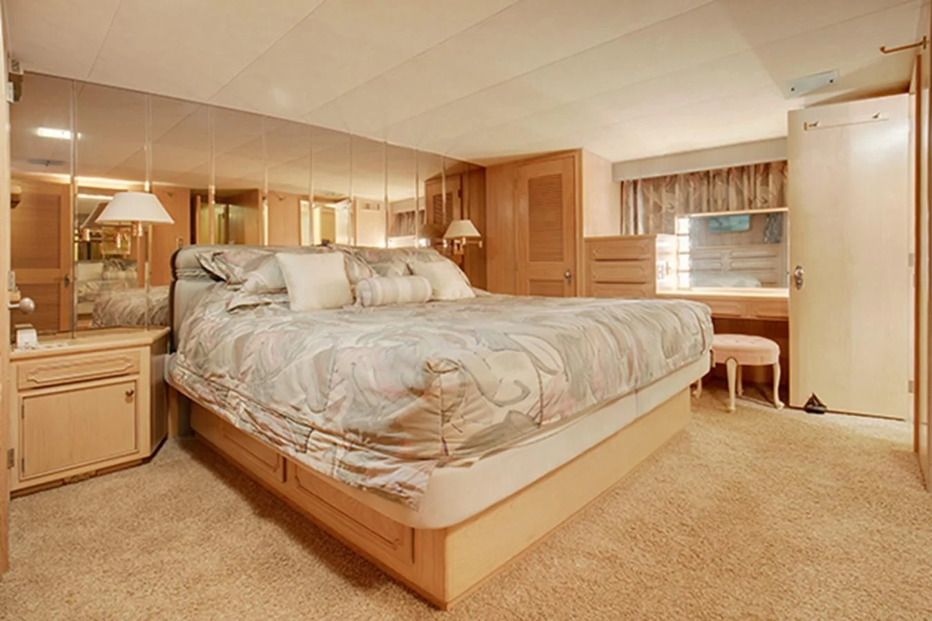 a large bed in a room aboard EXCALIBUR Yacht for Sale