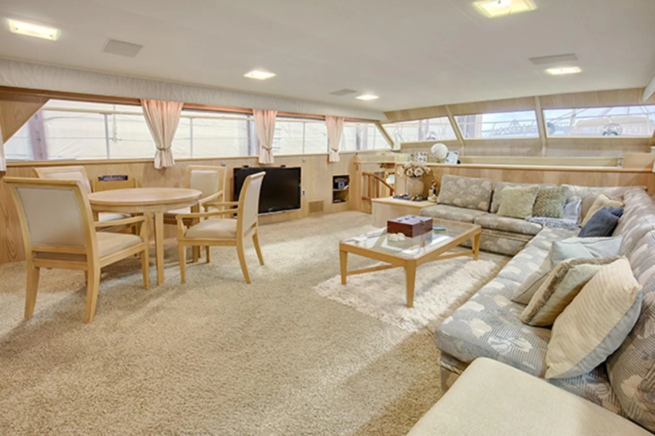 a living room with a couch and a television aboard EXCALIBUR Yacht for Sale