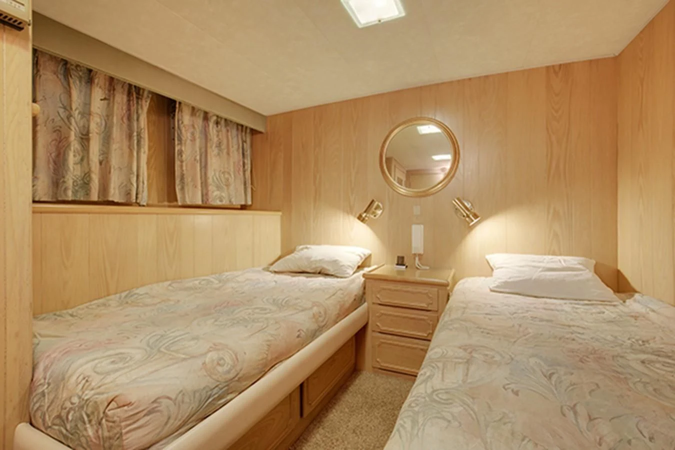 a couple of beds in a hotel room aboard EXCALIBUR Yacht for Sale