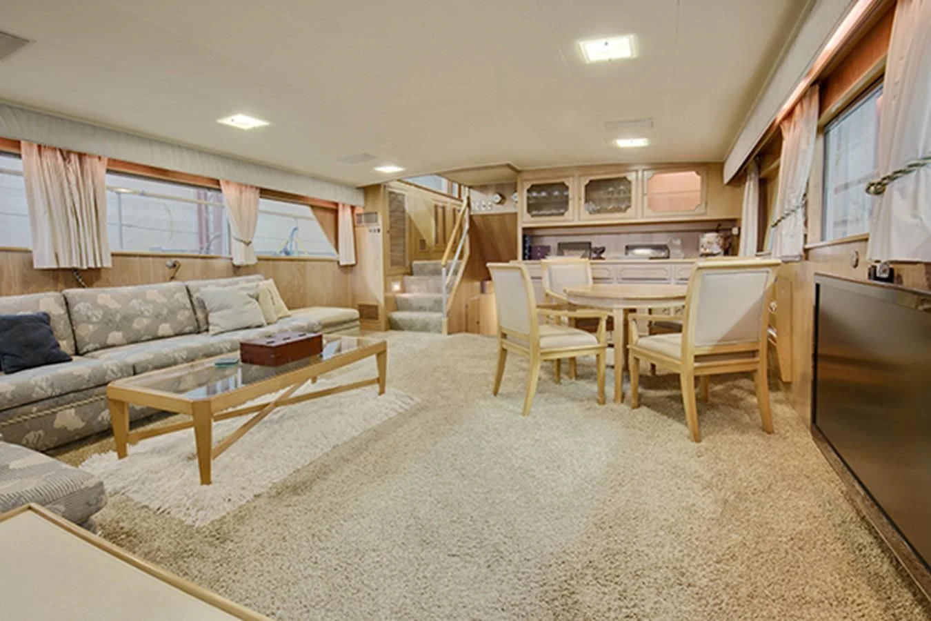 a living room with a couch and a table aboard EXCALIBUR Yacht for Sale