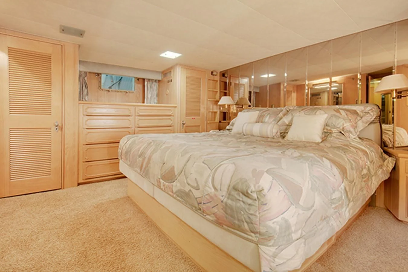 a large bedroom with a large bed aboard EXCALIBUR Yacht for Sale