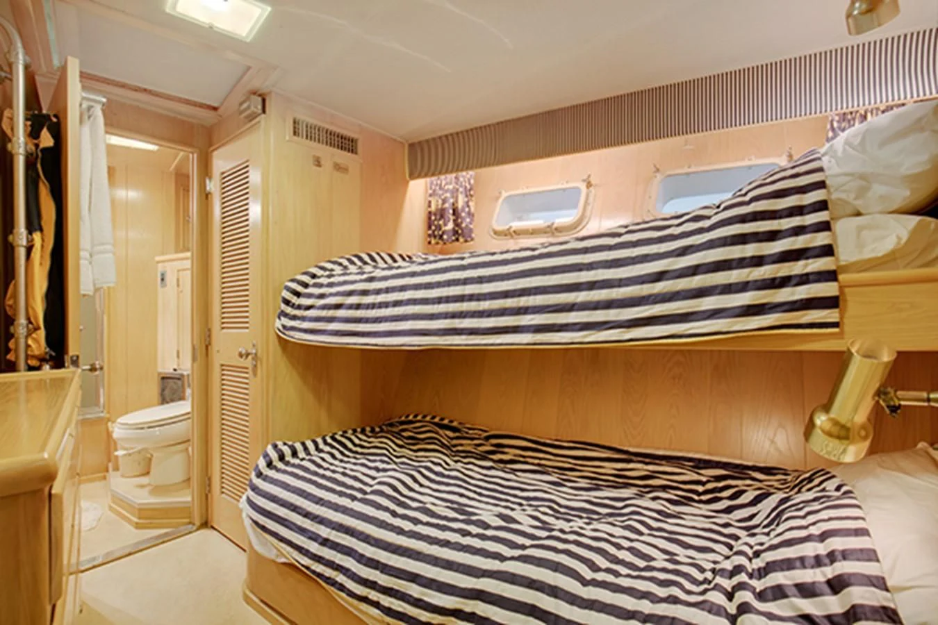 a bedroom with a bed and a sink aboard EXCALIBUR Yacht for Sale