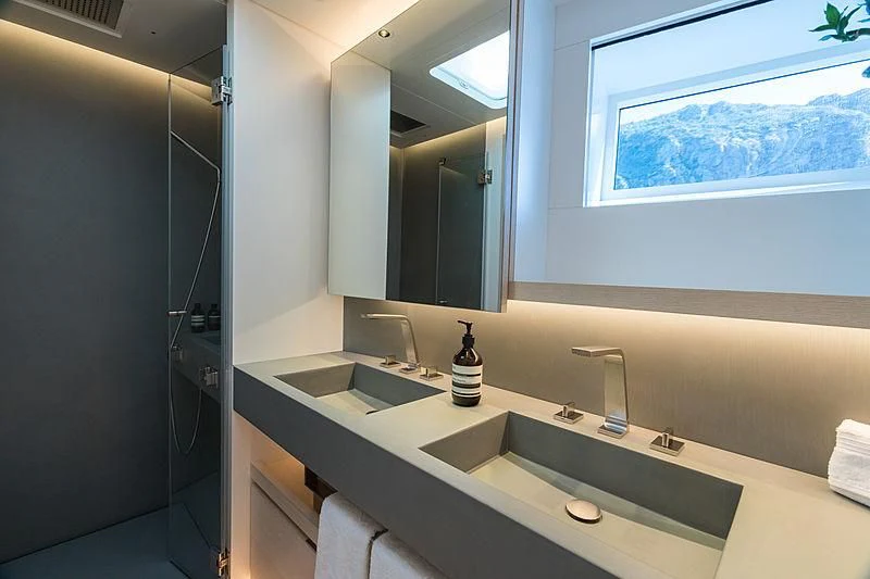 a bathroom with a large mirror aboard CERVO Yacht for Sale