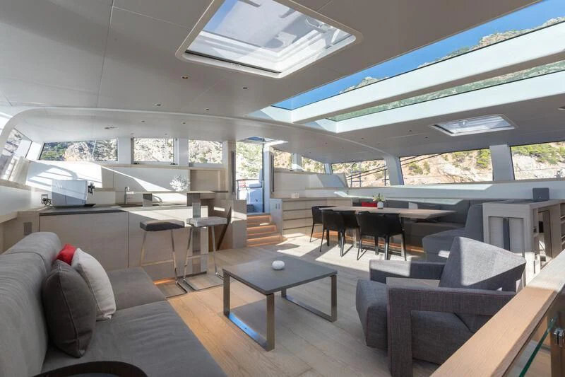 a room with a couch and a table aboard CERVO Yacht for Sale