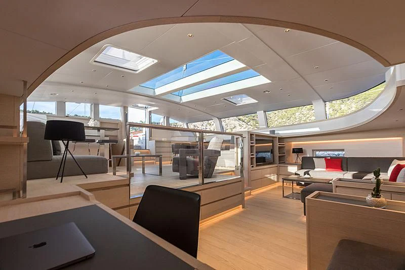 a room with a table and chairs aboard CERVO Yacht for Sale