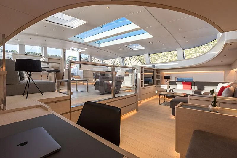 a room with a table chairs and a large window aboard CERVO Yacht for Sale