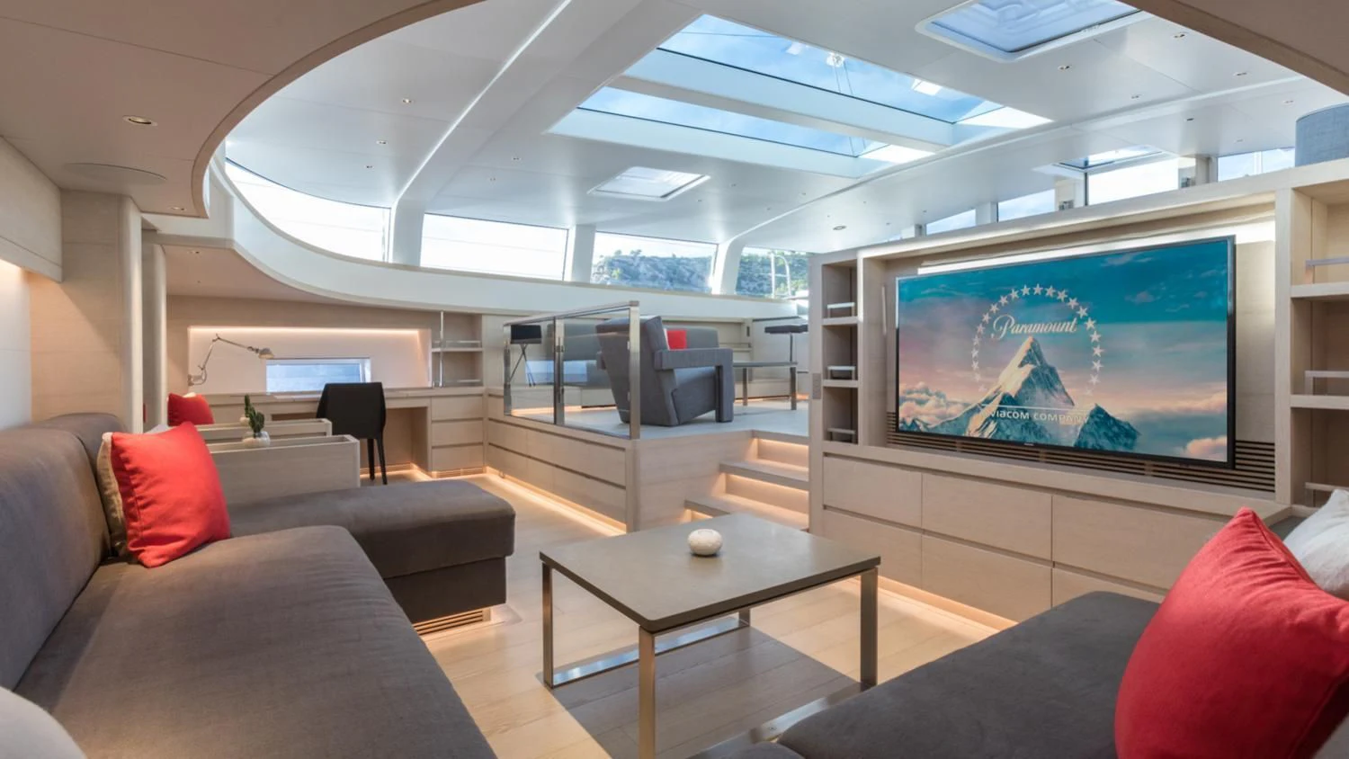 a living room with a large screen aboard CERVO Yacht for Sale