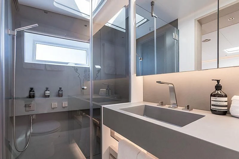 a bathroom with a glass shower aboard CERVO Yacht for Sale