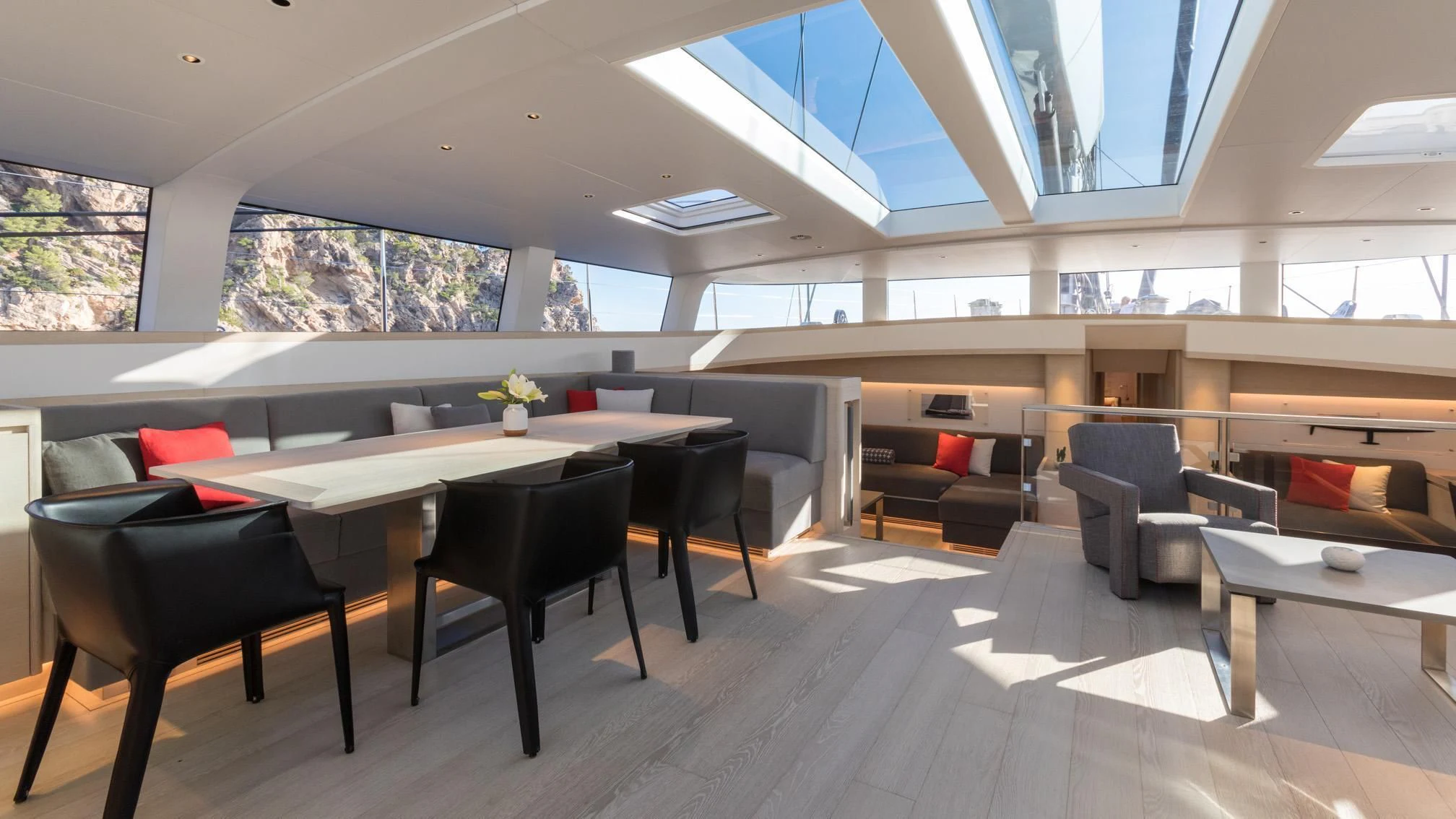 a room with a table and chairs aboard CERVO Yacht for Sale