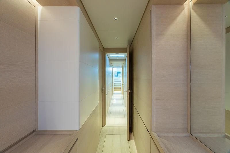 a hallway with white walls aboard CERVO Yacht for Sale