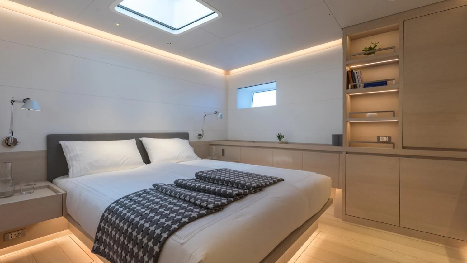 a bed in a room aboard CERVO Yacht for Sale