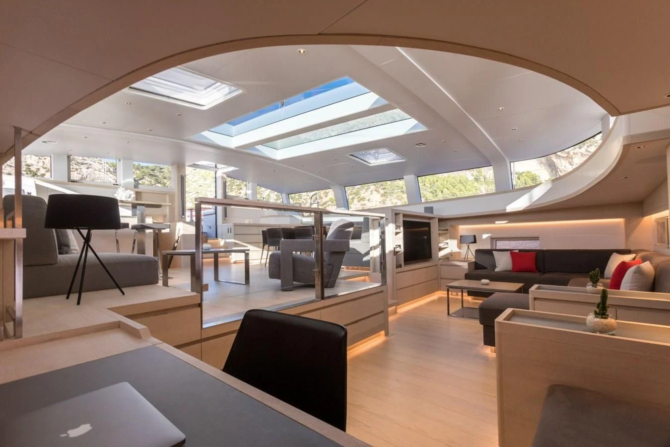 a room with a couch and a table aboard CERVO Yacht for Sale