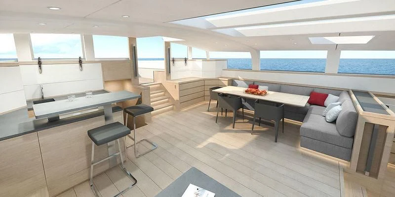 a room with a couch and a table and chairs aboard CERVO Yacht for Sale