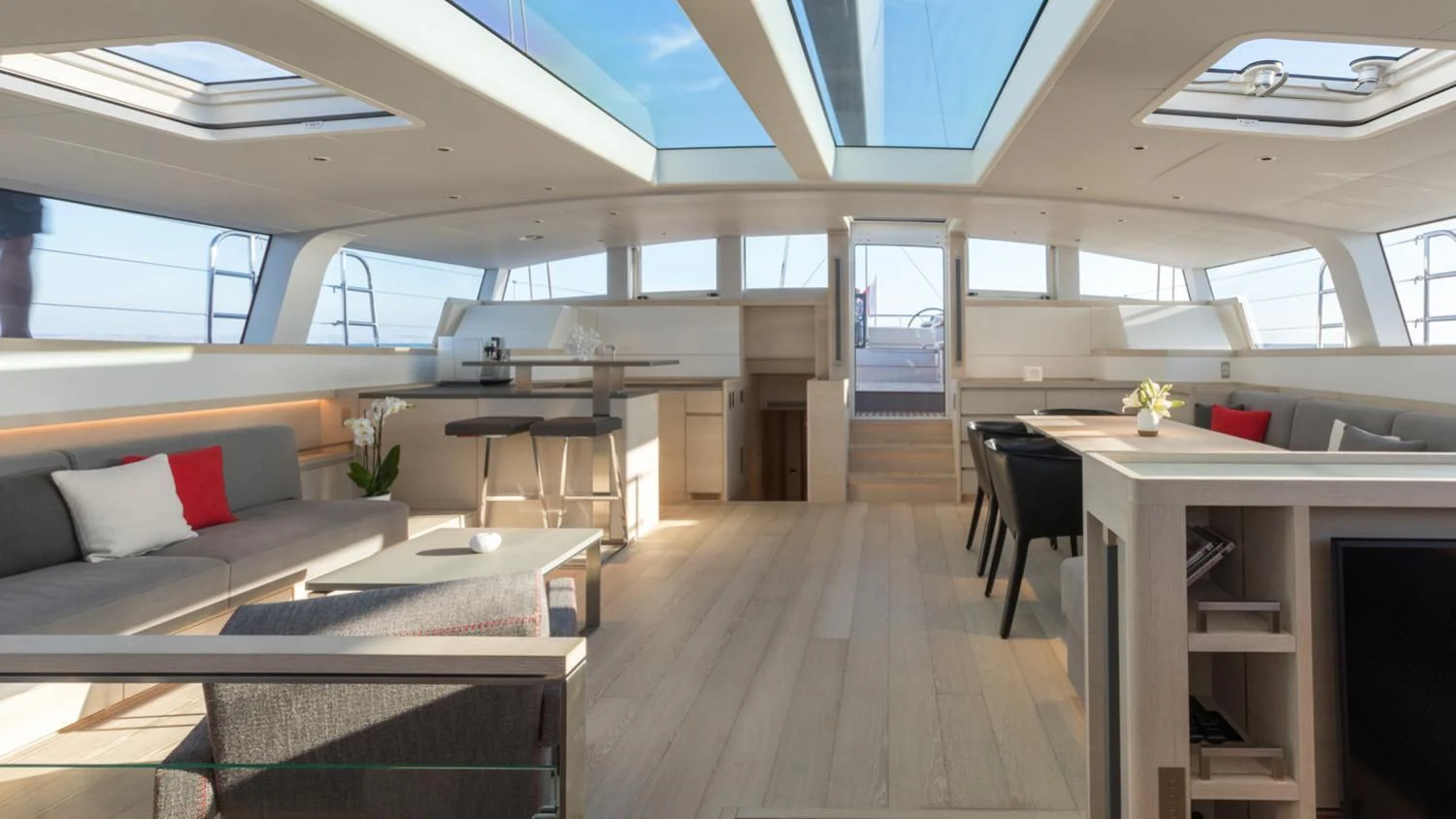 a room with a table and chairs aboard CERVO Yacht for Sale