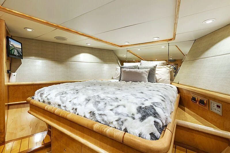 a bed in a room aboard HOLIDAY Yacht for Sale